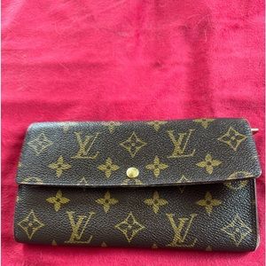 Louis Vuitton wallet. Chain added to use as crossbody.